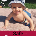 Photo of a smiling 6 month old baby in a sunhat on a picnic blanket. Text overlay says: "Safe Sunscreen Options (which is better: chemical or mineral?)"
