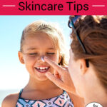Photo of a mother applying sunscreen to her laughing daughter's nose. Text overlay says: "Safe Sunscreen & Summer Skincare Tips (for adults, kids & babies!)"