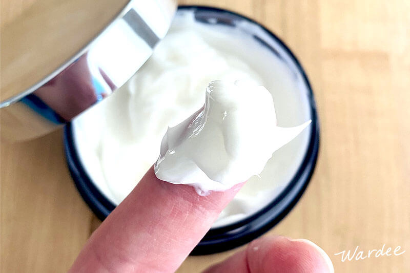 Overhead shot of a woman's finger holding up a dollop of