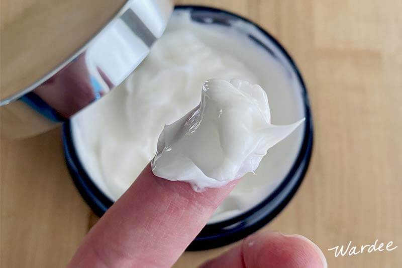 Overhead shot of a woman's finger holding up a dollop of