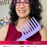 Photo of smiling woman with dark curly hair holding up a purple wide tooth comb. Text overlay says: "7 Ways to Reduce Frizzy Hair (+info on best styling products & tools)"