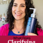 Photo of smiling woman with bottle of shampoo. Text overlay says: "What Does Clarifying Shampoo Do? Restore Soft, Shiny Hair (+best routines for all hair types)"