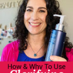 Photo of a smiling woman holding up a bottle of clarifying shampoo. Text overlay says: "How & Why To Use Clarifying Shampoo (what to do if your hair products stop working!)"