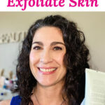 Photo of a smiling woman holding up a bottle of exfoliating scrub. Text overlay says: "How to Exfoliate Skin (fix dull, dry, flaky skin!)"