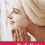 Photo of one woman applying a scrub to her face with her hair wrapped in a towel. Text overlay says: "How to Exfoliate Skin Naturally (+how often to exfoliate)"