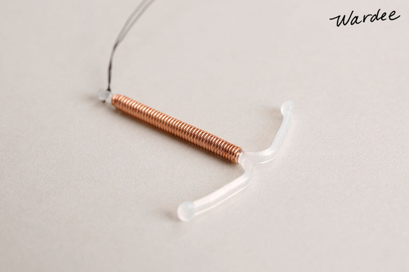 Close-up photo of a copper IUD.