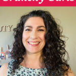 Smiling woman with dark curly hair. Text overlay says: "7 Tips to Avoid Crunchy Curls (how to use hair gel the best way)"