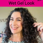 Smiling woman with dark curly hair. Text overlay says: "7 Tips to Avoid the Crunchy, Stringy, Wet Gel Look (get soft, defined, bouncy curls instead!)"