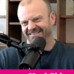 Photo of a smiling man sitting in his office in front of a microphone, being interviewed. Text overlay says: "How to Heal Skin Conditions Naturally (an interview with Dr. Garrett Smith, ND)"