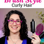 Photo of a smiling woman with curly hair, holding up various styling brushes. Text overlay says: "How To Brush Style Curly Hair (+the best brush to use!)"
