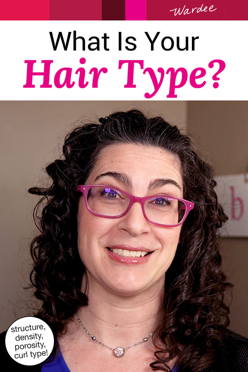 Photo of a smiling woman with curly hair, wearing pink glasses. Text overlay says: "What Is Your Hair Type? (structure, density, porosity, curl type!)"